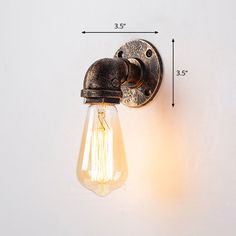 the light bulb is attached to the wall