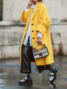 Elegant Yellow Winter Outerwear, Trendy Oversized Yellow Outerwear, Yellow Oversized Outerwear For Fall, Elegant Yellow Outerwear With Pockets, Oversized Yellow Outerwear For Fall, Yellow Long Coat For Fall, Oversized Yellow Outerwear For Spring, Yellow Long Coat For Winter, Chic Yellow Single Breasted Outerwear