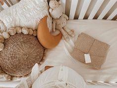 a baby is sleeping in his crib with stuffed animals