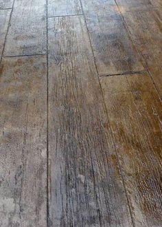 an old wooden floor with peeling paint on it