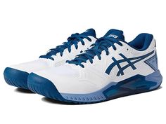 a white and blue tennis shoe is on a white surface, with the word asics above it