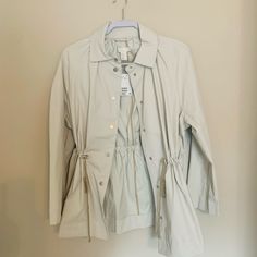 Small H&M Beige Jacket With Wider Sleeves And Cute Waist-Cinching Capabilities! Never Worn, Would Be Great For Spring, Fall And Rainier Days. Casual Cream Outerwear From H&m, Casual Cream Outerwear By H&m, Spring Neutral Button-up Utility Jacket, Beige Utility Outerwear For Summer, Summer Beige Utility Outerwear, H&m Spring Outerwear With Pockets, H&m Beige Outerwear For Spring, H&m Cream Outerwear For Spring, Cream H&m Outerwear For Spring