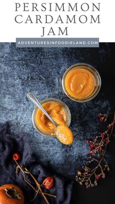 two small jars filled with homemade pumpkin marmalade jam on top of a blue cloth