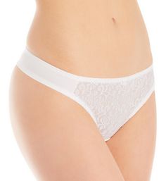 Sexy, classic thong with microfiber for a more comfortable feel. Made of nylon, polyester, and spandex. Waist and leg openings have soft-backed elastic around the inside. Front is unlined, sheer floral patterned lace front with glossy thread. Small daisy at front of waist with a faux pearl bead. Sides and back are silky matte microfiber for a comfortable stretch fit. Standard thong band. Mid-rise. Minimal rear coverage. Attached fabric information tag inside back of waist. Sewn-in cotton liner i White Seamless String Bottoms, White Partially Lined Briefs, Classic Briefs With Soft Touch, Tuxedo Women, Lace Front, Faux Pearl, Low Rise, Mid Rise, Carnival