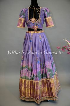 Indulge in the luxurious beauty of our Purple Floral Kanchi Silk Lehenga. With its intricately embroidered borders and delicate purple floral design, this lehenga is sure to make you the center of attention at any special occasion. Paired with a Kanchi Kalamkari Dupatta, experience an elegant fusion of traditional and modern styles. Brocade Sets With Floral Embroidery For Reception, Fitted Brocade Sets With Floral Embroidery, Floral Embroidered Brocade Lehenga, Fitted Brocade Lehenga With Floral Embroidery, Traditional Wear With Floral Embroidery In Brocade For Reception, Diwali Brocade Traditional Wear With Floral Embroidery, Fitted Floral Embroidered Tissue Silk Sets, Fitted Floral Embroidery Silk Sets, Fitted Art Silk Sets With Motifs