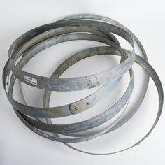 four metal circular objects sitting on top of each other