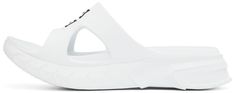 Rubber slip-on sandals in white. · Fixed strap with cut-outs at vamp · Logo printed at vamp · Logo embossed at textured rubber footbed · Sculptural foam rubber midsole · Logo embossed at heel · Treaded rubber outsole Supplier color: White Modern White Sport Sandals With Round Toe, Modern White Sandals With Rubber Sole, Modern White Open Toe Sport Sandals, White Open Toe Sport Sandals With Textured Footbed, Modern White Sport Sandals, White Slip-on Sport Sandals With Removable Insole, Modern White Synthetic Sport Sandals, White Synthetic Sandals With Textured Sole, White Sandals With Translucent Outsole For Beach