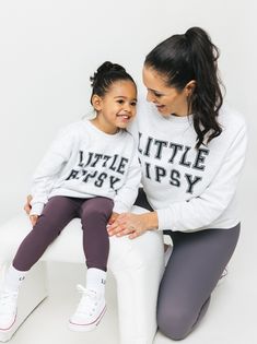 Calling all LB superfans! The most stylish way to show your LB pride is our Collegiate Crewneck, featuring classic 'Little Bipsy' text + the familiar, cozy feel of your favorite college sweatshirt. Pair it with our Athletic Ribbed Biker Short or Legging to rep LB from head to toe! Color: Grey 'LITTLE BIPSY' printed on the front Ribbed neckline, cuffs, and bottom hem Rollable + cinched wrist cuffs Material + Wash: 86.7% cotton | 13.3% polyester Do not bleach Machine wash cold with like colors Dry Varsity Tops For Everyday Fall Wear, Everyday Fall Varsity Tops, Everyday Varsity Fall Tops, Athleisure Sweatshirt With Letter Print For Game Day, Fall Relaxed Fit Letter Print Activewear, Casual Tops With Name Print For Loungewear, Sporty Tops With Letter Print And Cozy Fit, Fall Crew Neck Activewear With Letter Print, Fall Activewear With Letter Print And Crew Neck