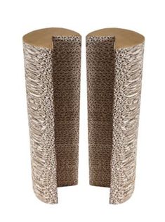 two tall vases sitting side by side on top of each other, one with an animal print pattern