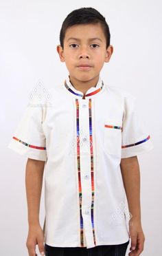 Typical Mexican Guayabera shirt for KIDS. Assortment of different shirt cuts. Machine-made by our Chiapas artisans on a multi-colored blanket. Handcrafted design work that, although they follow the same pattern, the colors of the embroidered geometric strips-stripes and details of the shirts may vary from piece to piece. Some guayaberas are buttoned and others are pullover type. Material: blanket (cotton). Sizes: 1, 2, 3, 4, 6, 8, 10 and 14. Primary Color: Multiple Colors. Machine made. Availabi Traditional Multicolor Cotton Shirt, White Cotton Tops With Traditional Patterns, White Cotton Top With Traditional Patterns, Traditional Multicolor Summer Shirt, Artisan Multicolor Cotton Top, Mexican Shirt, Mexican Shirts, Guayabera Shirt, Boy Models