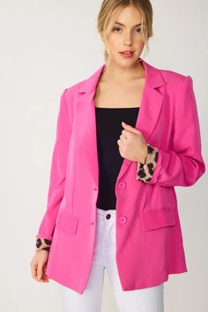 Spice up your look with this solid cobalt blazer! This timeless two button design is given a city chic twist with leopard print lining along the pockets and lapel. Hot pink Two Button Blazer Pocket Leopard lining Self 95% Poly 5% Span Affordable Pink Button-up Blazer, Cheap Pink Button-up Blazer, Cobalt Blazer, Blazer Pocket, Pink Solid, Button Design, Blazer Buttons, City Chic, Spice Up