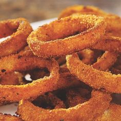 some onion rings are on a white plate