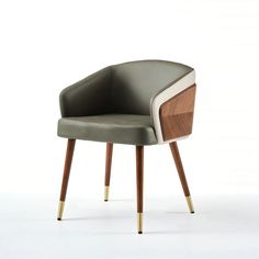 an upholstered chair with wood and leather