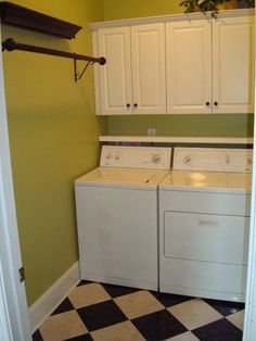 a white washer and dryer sitting in a laundry room next to each other