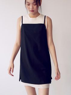 This is a layered dress with an attractive minimalist silhouette. The button details on the back and the color contrast details on the hem create a feminine mood, and you can adjust the shoulder straps to fit your body type. It can be worn alone or layered with an inner layer.- Made of high-quality wool blend material with a soft feel- Elastic so you can wear it comfortably- Open and close with back zipper*The color of the product may differ from the actual color depending on the monitor resolution. Elegant Knee-length Suspender Dress With Adjustable Straps, Chic Black Sleeveless Dress With Square Neck, Chic Black Sleeveless Square Neck Dress, Elegant Sleeveless Suspender Dress For Day Out, Black Sleeveless Dress With Straight Neckline, Chic Knee-length Dresses With Adjustable Straps, Elegant Midi Suspender Dress For Day Out, Chic Sleeveless Mini Dress With Adjustable Straps, Knee-length Suspender Dress With Adjustable Straps