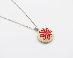 Beautiful hand embroidered necklace, with a red pattern from the Romanian folk embroidery, Moldova. Perfect for everyday wear.  * Chain length: measures between 43 cm - 76 cm (17"-30") depending on your choice (You can choose your desired necklace length from the drop-down menu. Leave a note at checkout for any custom length. )Other necklaces here: https://www.etsy.com/shop/needleschoice?section_id=21238247Your jewelry comes in a beautiful gift box which means it is ready for gift giving.Althoug Handmade Folk Style Jewelry For Gifts, Folk Style Handmade Jewelry As Gift, Handmade Folk Jewelry As Gift, Handmade Folk Style Jewelry Gift, Red Medallion Necklace For Gift, Traditional Embroidered Jewelry For Gifts, Traditional Embroidered Necklace For Gift, Handmade Red Medallion Necklace, Festive Red Embroidered Jewelry