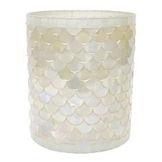 a white vase with fish scales on it