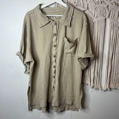 Brand: Free People Size: Small Condition: New Without Tags Description: Women’s Oversized Button Down Shirt. One Large Right Breast Pocket And Mid Length Sleeves. Ribbed Design With Side Slits. Shoulder To Hemline -31” Pit To Pit -25”. Casual Beige Tops With Button Cuffs, Casual Beige Top With Button Cuffs, Beige Relaxed Fit Top With Buttons, Casual Beige Blouse With Buttons, Beige Relaxed Fit Tops With Button Cuffs, Oversized Khaki Tops With Buttons, Oversized Beige Shirt With Button Closure, Casual Beige Blouse With Button Cuffs, Beige Button-up Top With Button Cuffs