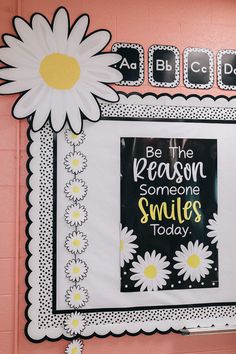 a bulletin board with flowers on it and the words be the reason someone smiles today