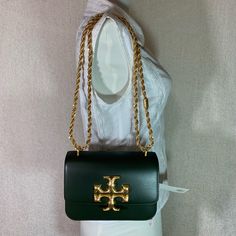 Eleanor Small Convertible Shoulder Bag/Cross Body Bag By Tory Burch. This Bag Is Made Of Dark Green Genuine Smooth Leather.. Small Press Mark From The Chain Strap On The Upper Back As Shown This Bag Is Convertible. Can Be Carried As A Shoulder Bag Or Cross Body Bag. Dimensions: 7.5" Wide Across Bottom X 5" Tall Center X 2.5" Deep. Strap Drop Doubled 11.5", Single 22". Interior: 3 Compartments. 1 Zipper Compartment Flap Closure Secured With Magnetic Button. Leather Interior. Gold Tone Metalware. Tory Burch Crocodile Bag, Designer Green Bag With Chain Strap, Luxury Tan Bag With Chain Strap, Designer Tan Bags With Chain Strap, Lv Neonoe, Sling Bag Black, Luxury Bags Collection, Tory Burch Purse, Tory Burch Handbags