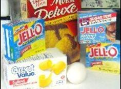 some food items are sitting on a counter top next to boxes and containers with jello in them