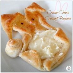 cream cheese dessert bunnies on a plate with the words cream cheese crescent bunnies