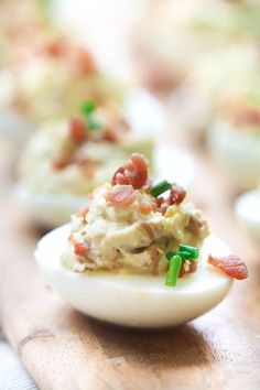 small deviled eggs with bacon and green onions