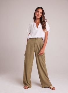 Introducing our Cargo Wide Leg Pant, the perfect addition to your summer wardrobe. This relaxed fit trouser is designed to provide both comfort and style, allowing you to effortlessly elevate your look. 100% TENCEL ™ Lyocell. SIZE WAIST WAIST TO HEM INSEAM XS 25" 42 1/4" 31" S 27" 42 3/4" 31" M 29" 43 1/4" 31" L 31" 43 3/4" 31" Bella Dahl, Essential Dress, Wide Leg Pant, Fitted Trousers, Mini Dress Shop, Romper Dress, Romper Pants, Summer Essentials, Summer Wardrobe