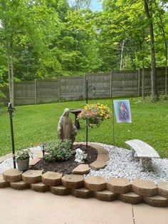 a small garden with a statue in the middle