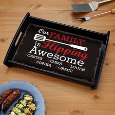 a serving tray that says our family is flipping awesome, with grilled zucchini on the side