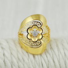 Inspired by the timeless beauty of traditional Indian artistry, this 22k gold ring embodies grace and sophistication. Handcrafted with intricate detailing, the design showcases a blend of classic motifs and contemporary flair. Perfect for marking special occasions or adding a touch of luxury to your everyday look, this ring celebrates the richness of Indian heritage with every gleaming curve. 22k gold ring handmade jewelry made in India weight is 4.12 grams approx. ring size is 8 US  ring face/w Venkateswara Swamy Gold Rings, 22k Gold Ring, Gold Flower Ring, Indian Heritage, Jewelry Indian, Gold Flower, Traditional Indian, Flower Ring, 22k Gold