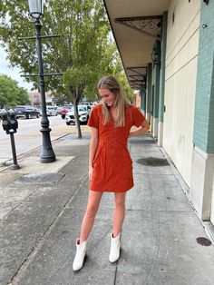 The ultimate statement piece - this fitted corduroy dress in Rust Orange! This luxe mini dress and features a collar, zipper front, and belted waistline, plus stylish braided detailing along the front pockets. Transition into Fall in this effortless look! Model is 5'2" with a 25" waist, 31" hips and a 32" Bust and wearing a small. 100% Polyester Southern Summer Dresses, Corduroy Dress, Rust Orange, Front Zipper, Hats For Men, Jumpsuit Dress, Aurora, Rust, Dress Outfits