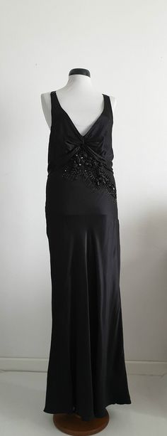 "Amazing Robert Cavalli black silk full -length dress with deep v neckline and open back , unique dimensional flowers with small beads ,bias construction, side zipper and tie back closures. ✂-----Measurements : fits like: medium bust : 40\" waist: up to 38\" hip: up to 44\" length: 59 1/2\" brand/maker: Robert Cavalli condition: excellent Shipping Is Avaliable Worldwide. Every item is carefully shipped Priority via Air Mail - shipping takes from 7 to 14 working days, depending on your location. Elegant Embellished Slip Dress For Party, Evening Satin Backless Long Dress, Evening Long Satin Backless Dress, Silk Floor-length Evening Midi Dress, Dressy Silk Maxi Dress For Evening, Glamorous Sleeveless Backless Silk Dress, Elegant Embellished Backless Evening Dress, Elegant Embellished Backless Dress For Evening, Dressy Evening Maxi Slip Dress