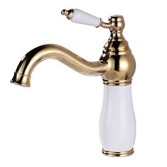 a white and gold faucet sitting on top of a sink