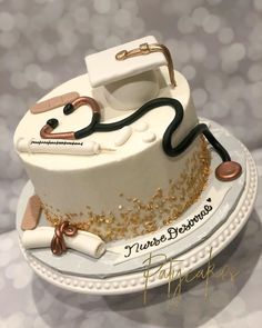 a cake with a stethoscope on it sitting on top of a plate