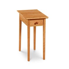 a small wooden table with one drawer on the top and two legs at the bottom