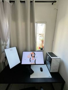 there is a desk with a computer and other items on it