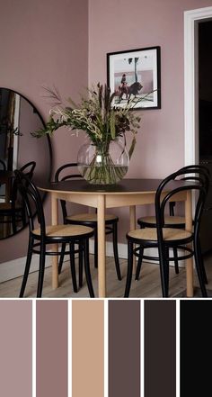 a dining room table with chairs and a vase filled with flowers