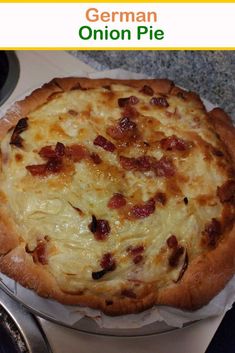 a close up of a pizza on a plate with cheese and bacon in the middle