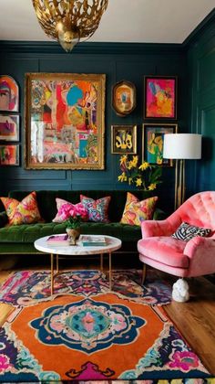 a living room with green walls and colorful rugs on the hardwood floor, pink velvet couches, gold chandelier