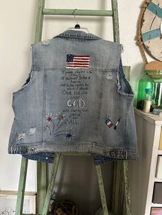 Upcycled denim vest with Americana art. Size is Extra large. One of a kind and super cute on! Bohemian Denim Vest For Spring, Bohemian Denim Sleeveless Vest, Distressed Sleeveless Denim Vest For Fall, Distressed Denim Sleeveless Vest For Fall, Fitted Distressed Cotton Vest, Distressed Medium Wash Vest For Spring, Casual Distressed Vest For Fall, Fall Bohemian Denim Vest, Bohemian Sleeveless Denim Vest