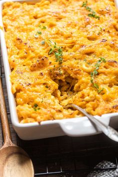 a casserole dish with cheese and parsley