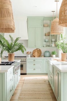 a kitchen filled with lots of green cabinets and white counter top space next to an oven