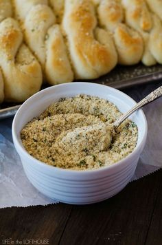 bread rolls and dip in a white bowl