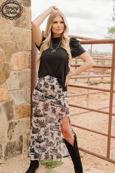 Spice up your wardrobe with the Rodeo Road Skirt! This cream mesh skirt features a fun pattern of black drawings depicting rodeo events, with built-in shorts for comfort and convenience. Perfect for a day out with the girls or a night on the town! Giddy up!Model is wearing an XS and is 5'7" 94% polyester 6% spandex Black Drawings, Rodeo Events, Western Skirts, Crazy Train, Mesh Skirt, Cool Patterns, Spice Up, Rodeo, Long Skirt