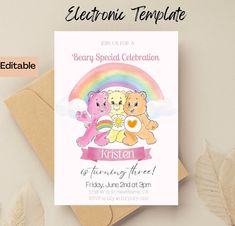 a birthday card with two teddy bears and a rainbow in the sky, on top of a brown envelope