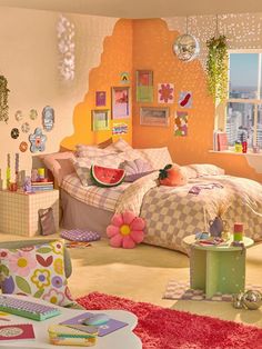 a bedroom decorated in pink, yellow and green