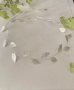 Silver Bridal Leaf Tiara | Wedding Hair Accessory | Silver Leaves Hair Vine|Silver Laurel Leaves Headpiece |Silver Leaves wreath Perfect for a wedding, brides, bridesmaids, flower girls, special occasion, or any day in which you want to feel like a goddess. This is a vintage inspired Bridal hair vine/tiara is made with hand wired pretty silver metal leaves and is light and easy to wear. Silver metal leaves are delicately hand-wired to create an effortless bohemian look. This vine is available in 50 cm length  Hand-wired nature allows for re-shaping to perfectly fit your hairstyle Leaf hair pins available in my shop : https://www.etsy.com/uk/listing/1241669591/silver-leaves-bridal-hair-pins-wedding?click_key=bb5e46f4041d7a54c9061da43df69c501bf38f71%3A1241669591&click_sum=c01ec83c&ref=shop_h Tiara Wedding Hair, Leaf Tiara, Pearl Hair Pin Wedding, Bridal Hair Pins Pearl, Grey Pearl Earrings, Leaves Wreath, Silver Head Piece, Wedding Brides