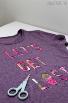 a t - shirt that says let's get scissors on it