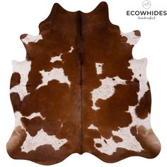 a brown and white cowhide rug on a white background